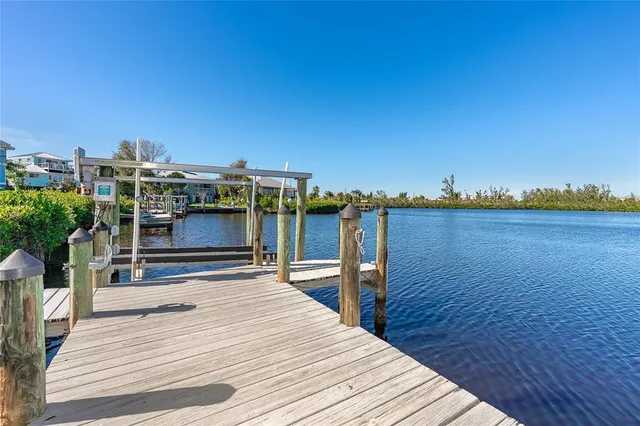 a view of a house with a yard and deck
