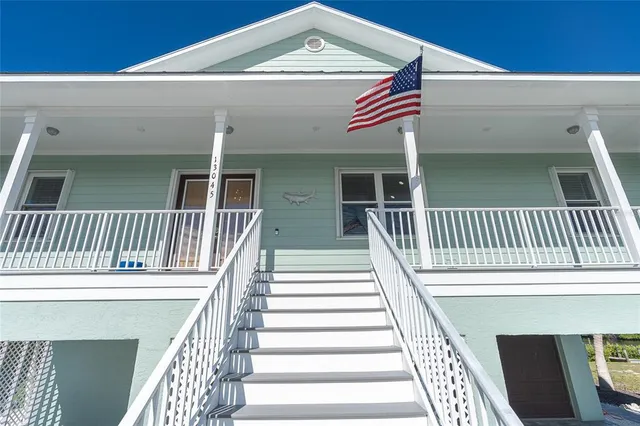 a view of balcony with wooden floor