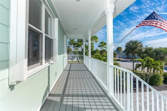 a view of a bedroom with wooden floor and chair