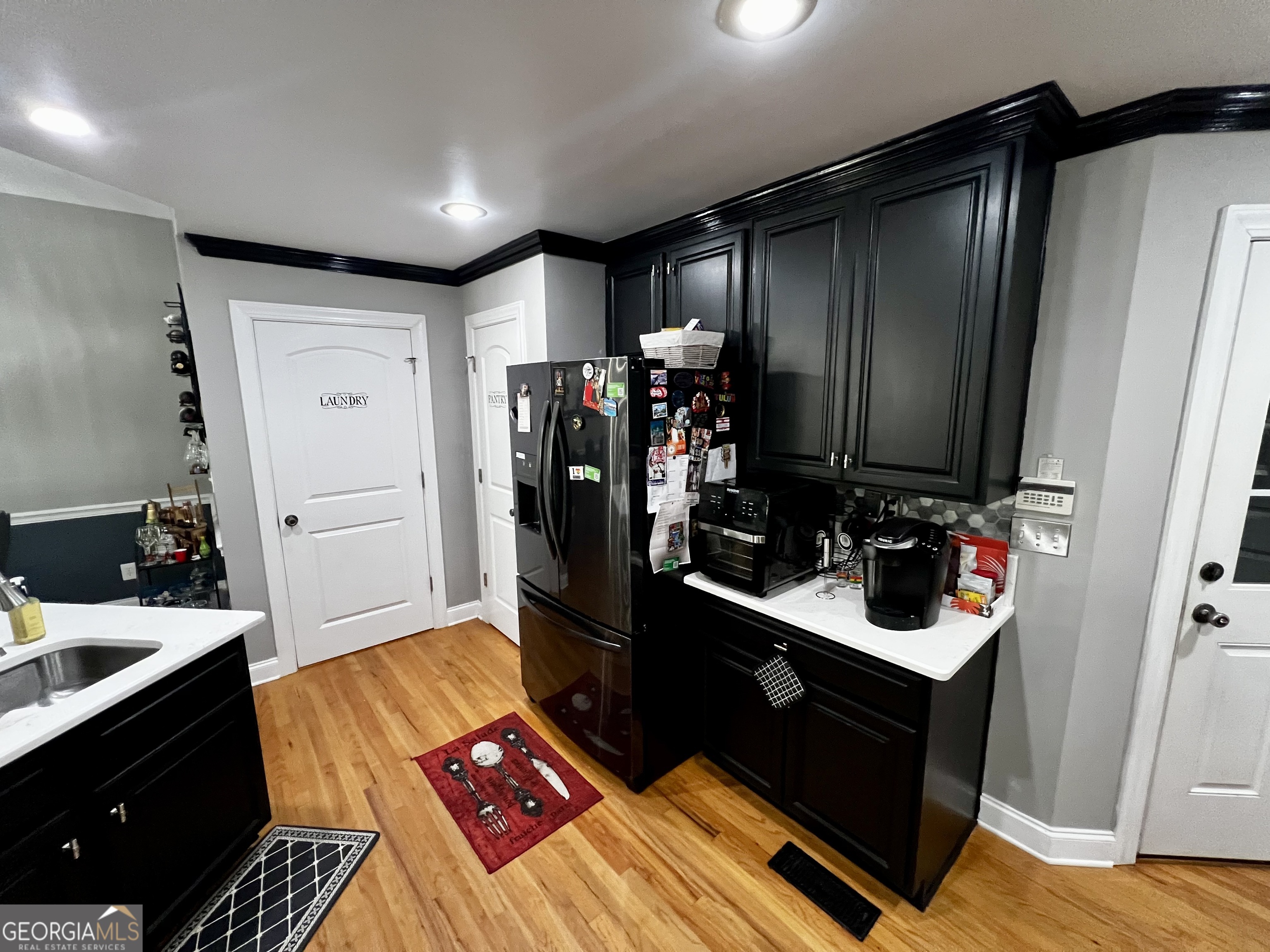 1104 Boulder Drive Gray, GA 31032 - Photo 17 of 81 a living room with a bed and a dresser with wooden floor