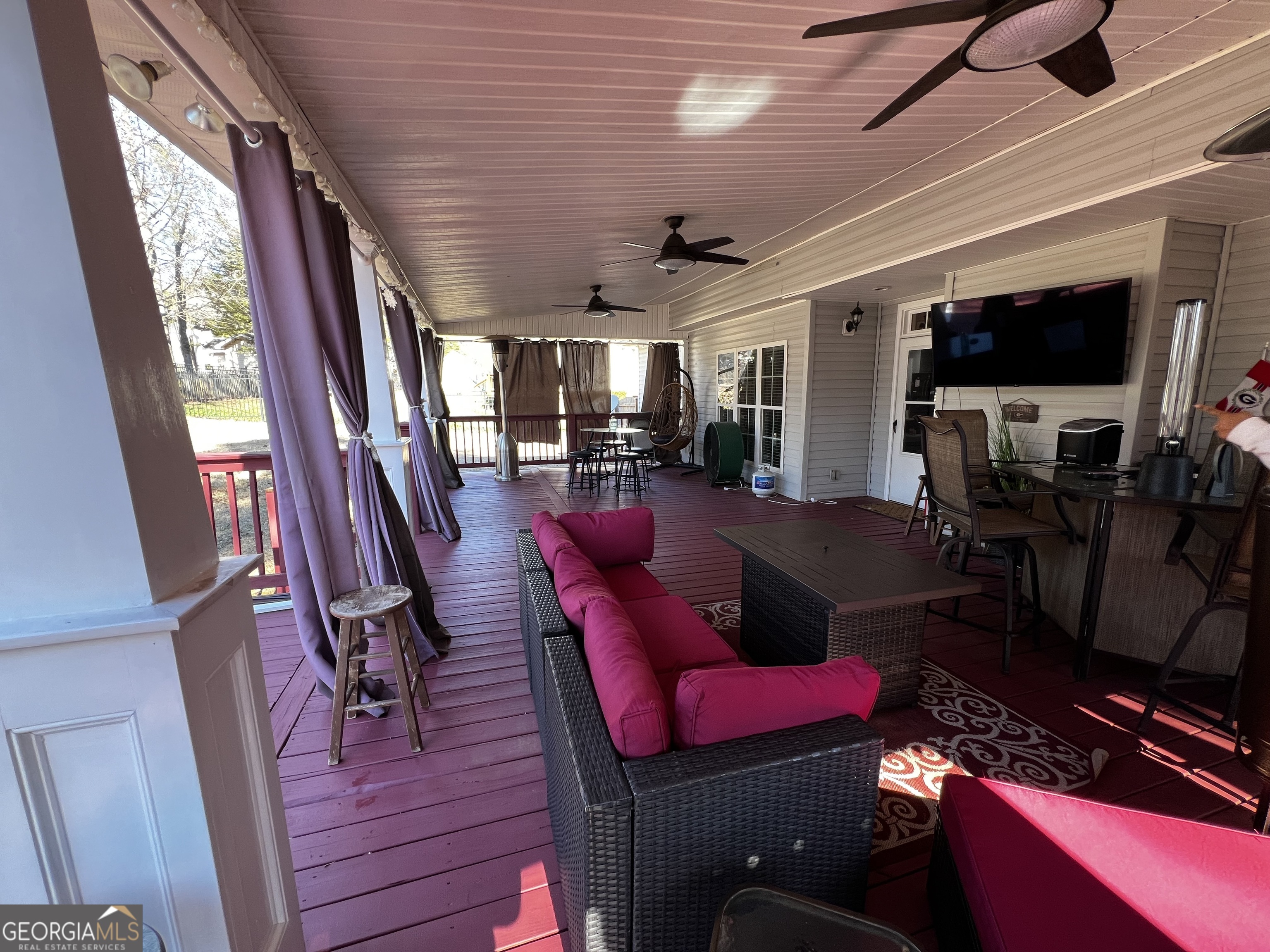 1104 Boulder Drive Gray, GA 31032 - Photo 64 of 81 a living room with furniture a flat screen tv and a floor