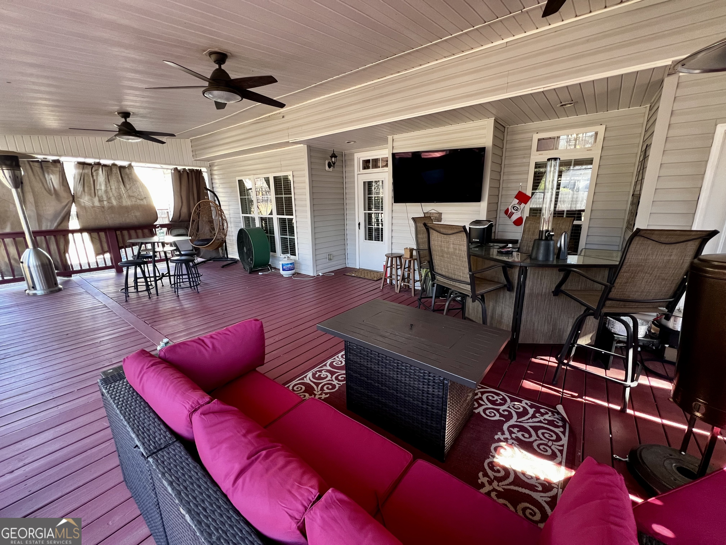 1104 Boulder Drive Gray, GA 31032 - Photo 69 of 81 a living room with furniture a flat screen tv and kitchen view
