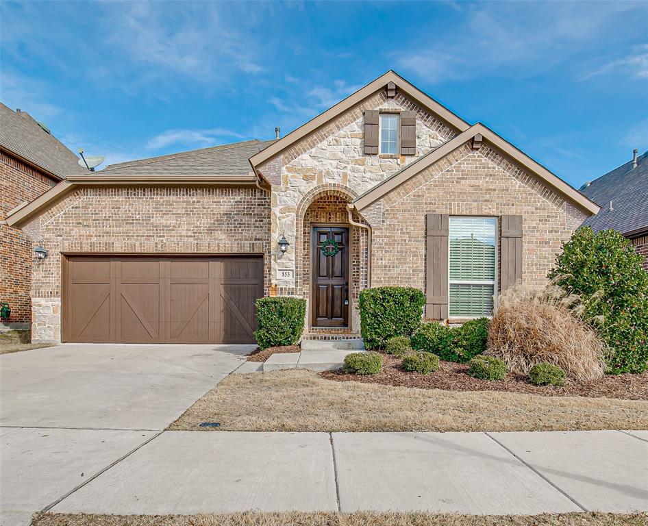 853 Field Crossing Little Elm, TX 76227 - Photo 1 of 1 a front view of a house with a yard and garage