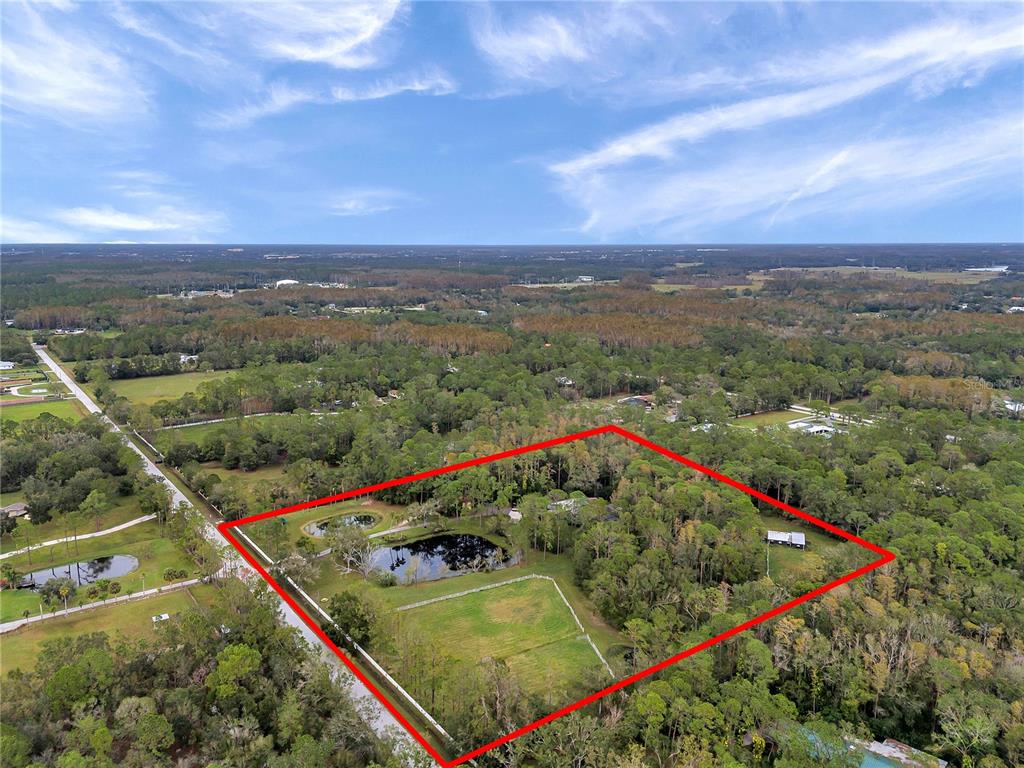 655 Appaloosa Road Tarpon Springs, FL 34688 - Photo 2 of 12 a view of a tennis court