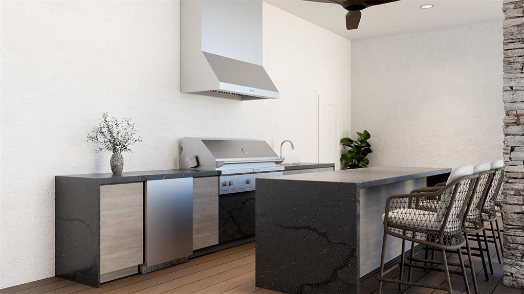 655 Appaloosa Road Tarpon Springs, FL 34688 - Photo 9 of 12 a kitchen with stainless steel appliances a table and chairs in it