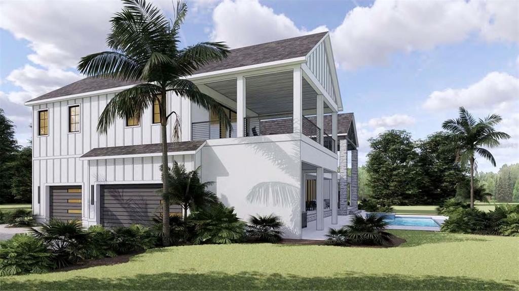 655 Appaloosa Road Tarpon Springs, FL 34688 - Photo 10 of 12 a view of a white house with a yard and potted plants