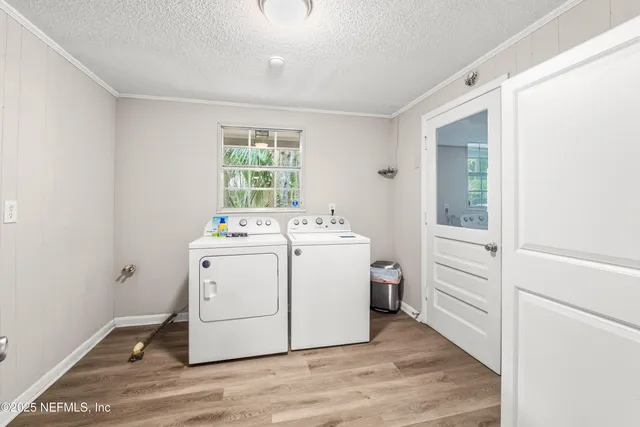 a utility room with a sink dryer and washer