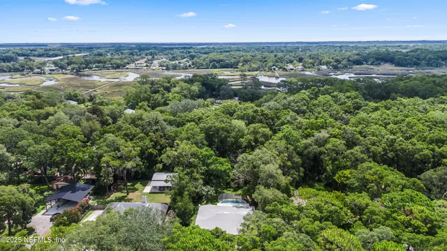 a view of a garden with an ocean and mountain view