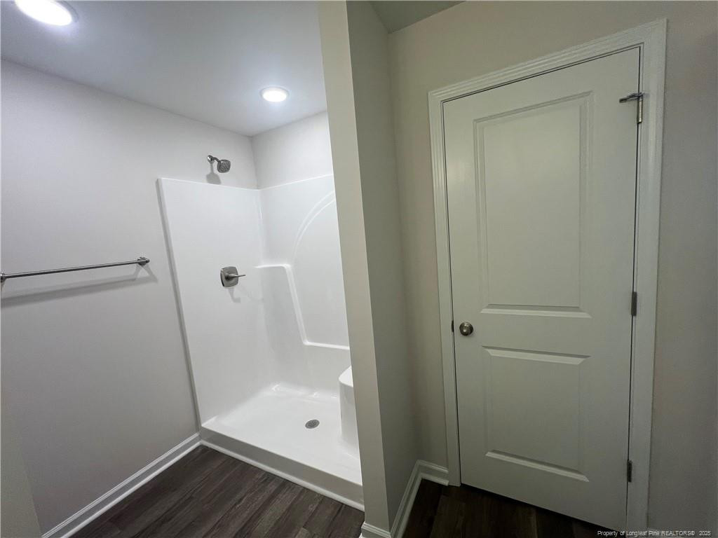 92 Dalton Drive Benson, NC 27504 - Photo 10 of 19 a bathroom with a glass shower door