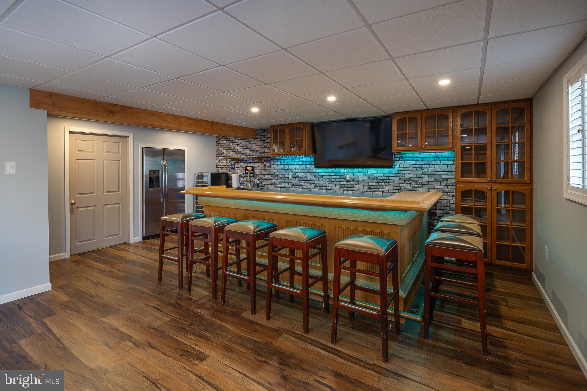 10053 Field Court Manassas, VA 20110 - Photo 25 of 43 Lower Level Bar with Custom Lighting