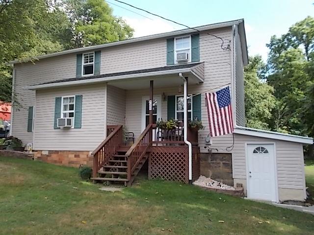 720 Grove Street Emlenton, PA 16373 - Photo 1 of 18 a front view of a house with a yard