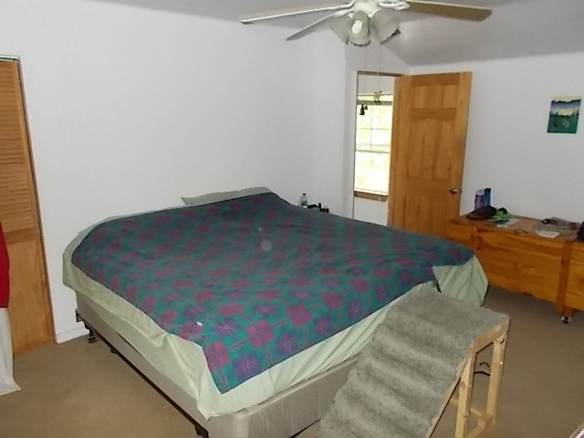 720 Grove Street Emlenton, PA 16373 - Photo 13 of 18 a bed sitting in a bedroom next to a window