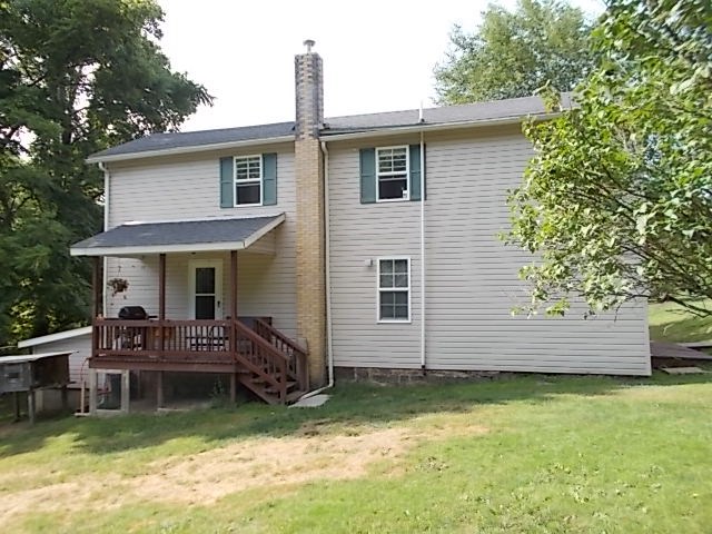720 Grove Street Emlenton, PA 16373 - Photo 5 of 18 a view of a house with a yard and sitting area