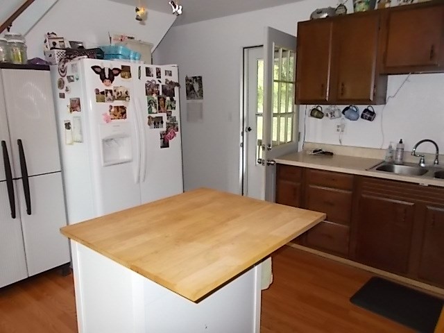 720 Grove Street Emlenton, PA 16373 - Photo 8 of 18 a kitchen with stainless steel appliances a refrigerator sink and wooden floor