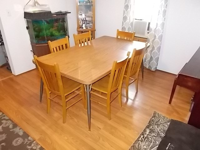 720 Grove Street Emlenton, PA 16373 - Photo 9 of 18 a view of a dining room with furniture and wooden floor