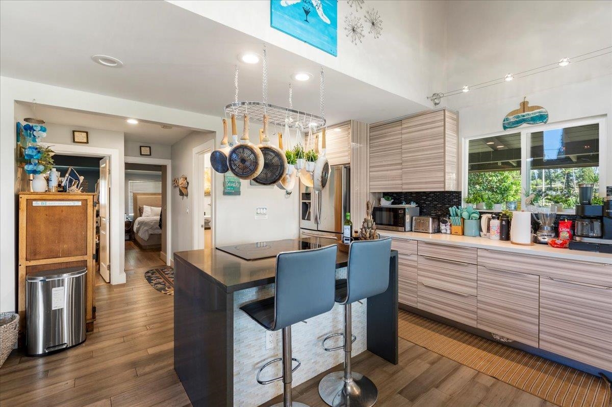 2861 Liholani Street Makawao, HI 96768 - Photo 12 of 42 a living room with furniture kitchen view and a large window