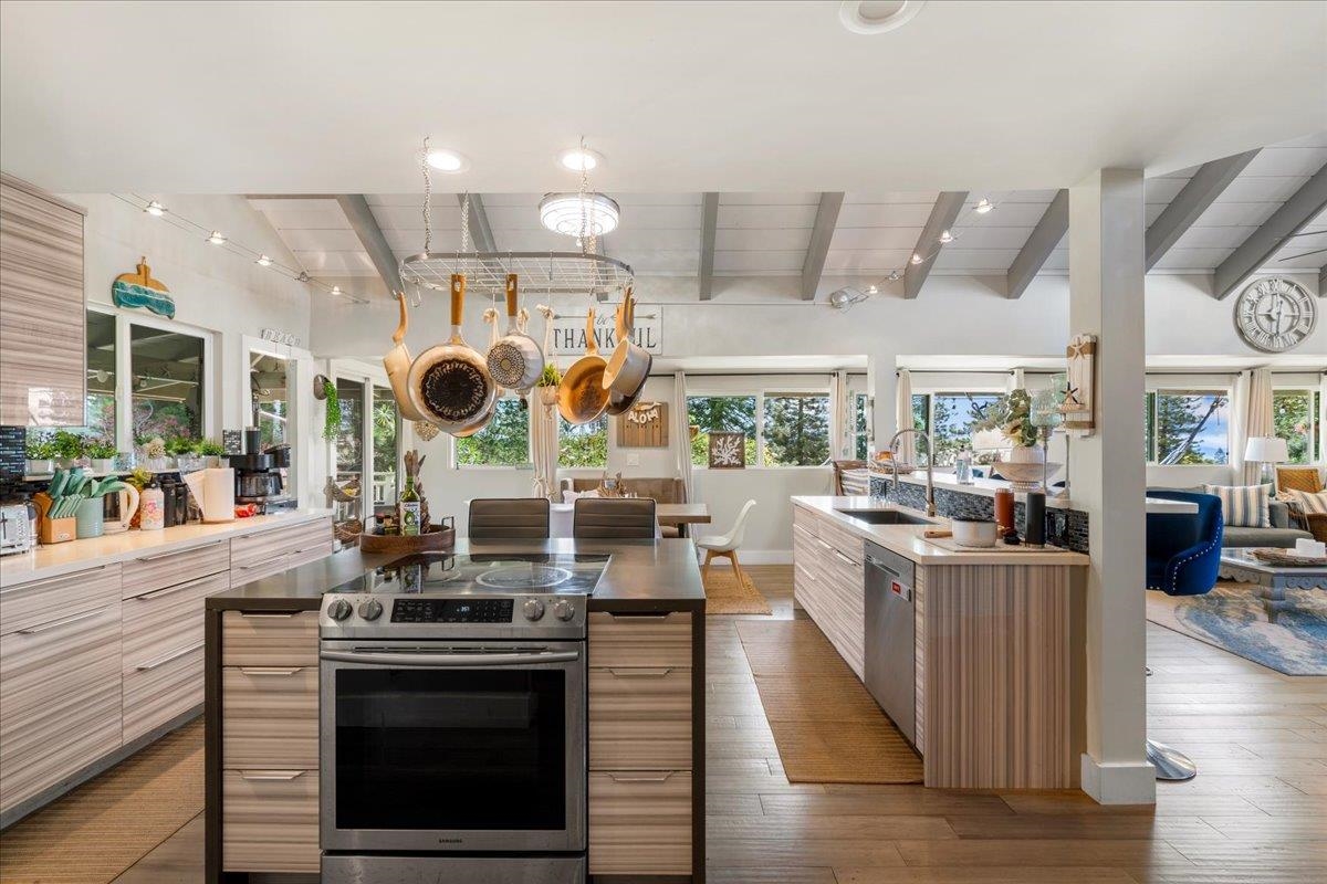 2861 Liholani Street Makawao, HI 96768 - Photo 14 of 42 a kitchen with stainless steel appliances granite countertop a stove and a view of living room
