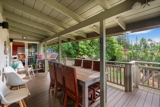 a view of a patio with furniture and wooden floor