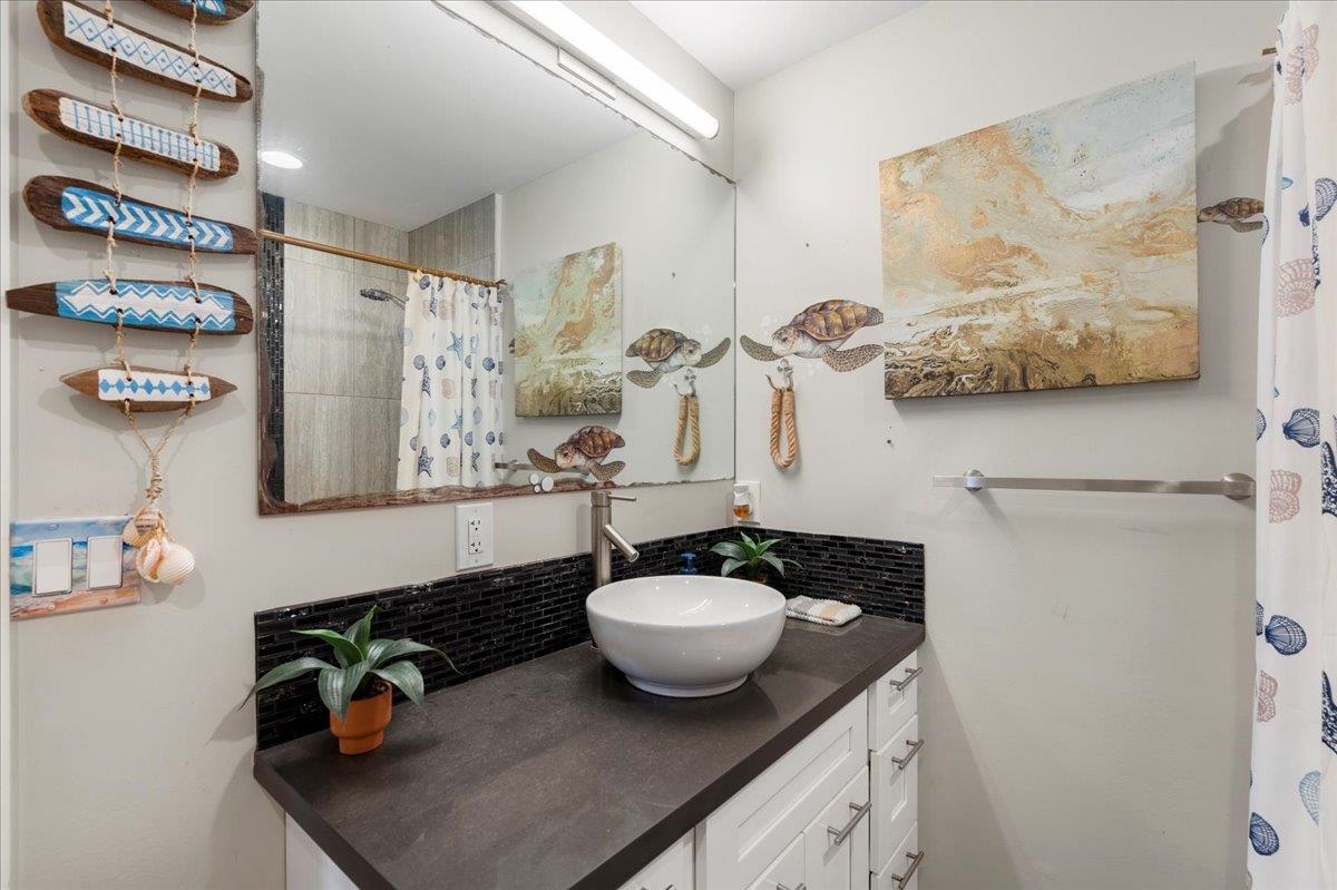 2861 Liholani Street Makawao, HI 96768 - Photo 25 of 42 a bathroom with a sink and a mirror