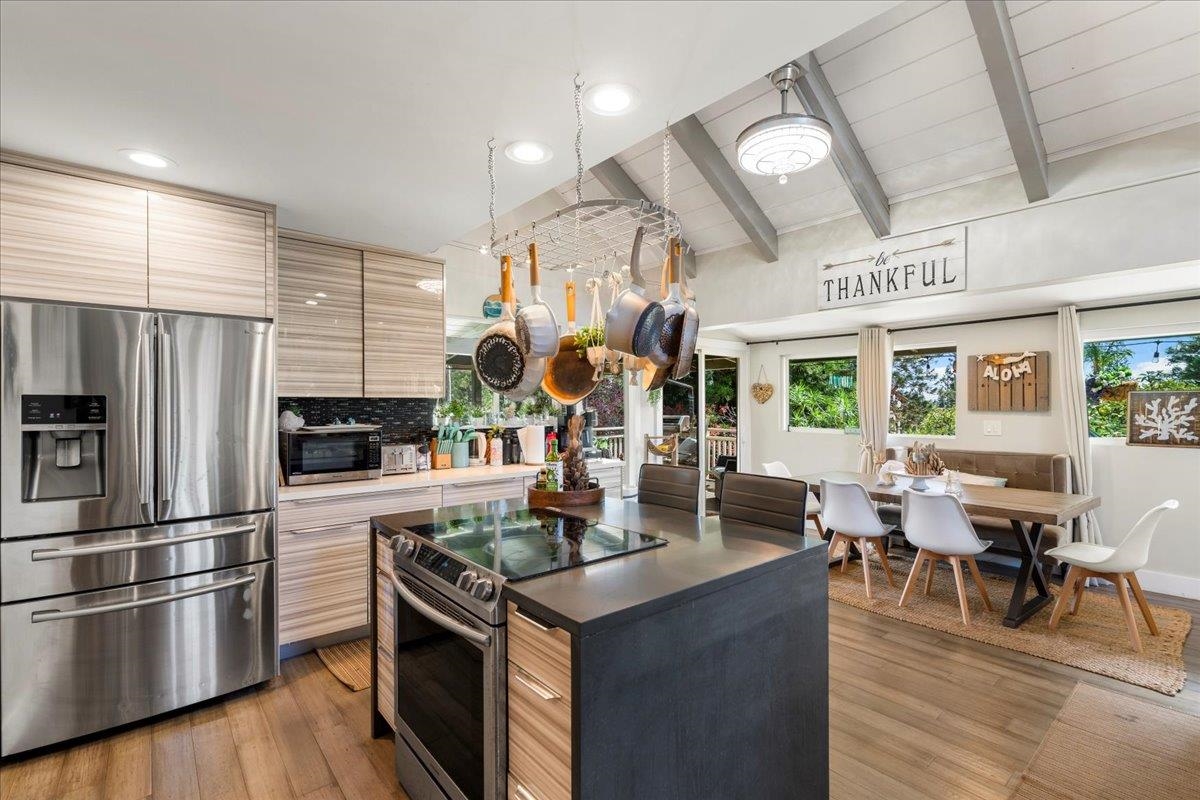 2861 Liholani Street Makawao, HI 96768 - Photo 4 of 42 a kitchen with stainless steel appliances granite countertop a stove and refrigerator