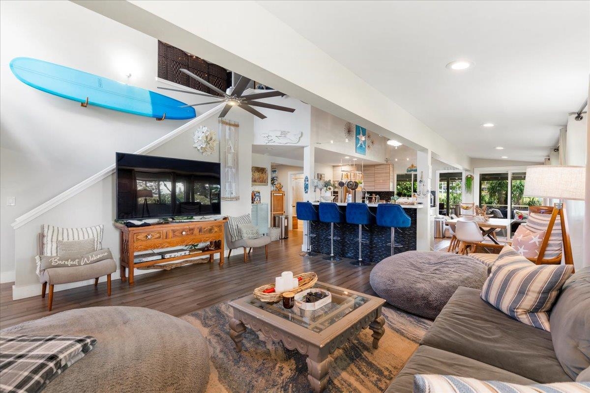 2861 Liholani Street Makawao, HI 96768 - Photo 9 of 42 a living room with furniture a pool table and a fireplace