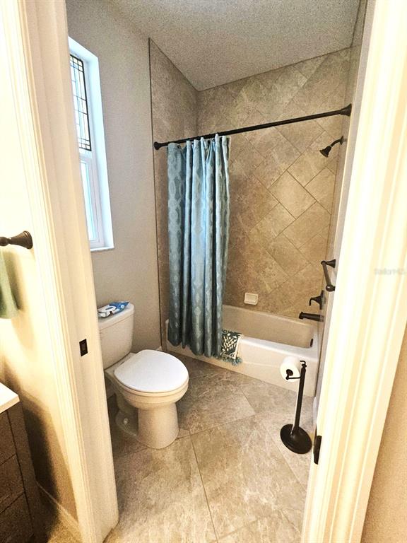 460 Marlin Road Venice, FL 34293 - Photo 21 of 44 a bathroom with a sink toilet and shower