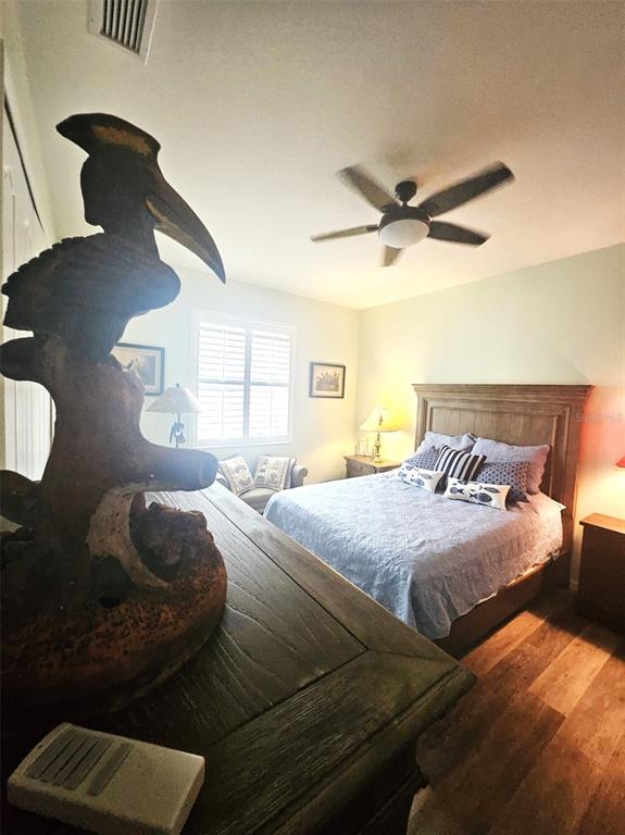 460 Marlin Road Venice, FL 34293 - Photo 26 of 44 a bedroom with a bed and a chandelier