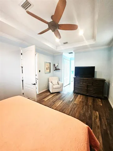 a spacious bathroom with a granite countertop sink a mirror and a bathtub