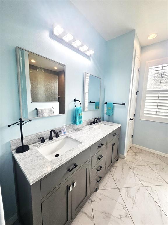 460 Marlin Road Venice, FL 34293 - Photo 32 of 44 a bathroom with a sink double vanity granite and a mirror