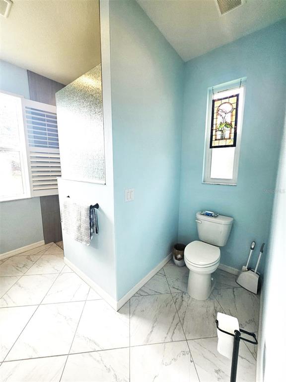 460 Marlin Road Venice, FL 34293 - Photo 33 of 44 a bathroom with a sink toilet and a mirror