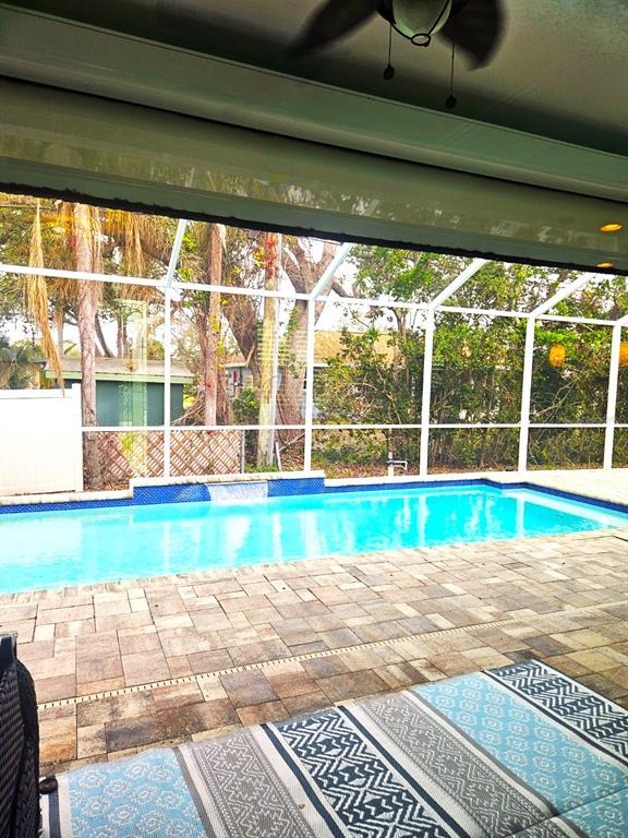 460 Marlin Road Venice, FL 34293 - Photo 36 of 44 a view of a room with wooden floor and a swimming pool