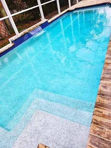 a view of a backyard with sitting area