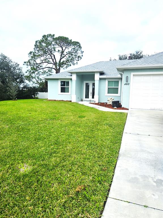 460 Marlin Road Venice, FL 34293 - Photo 40 of 44 a front view of a house with a garden and yard