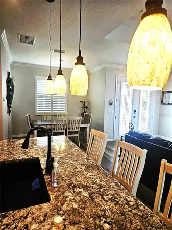 a kitchen with a stove microwave and refrigerator