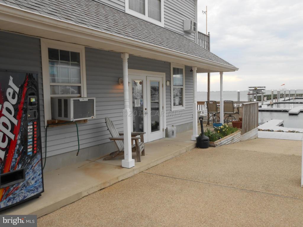 22 Pines Point Ocean Pines, MD 21811 - Photo 6 of 9 front view of a house with a outdoor seating