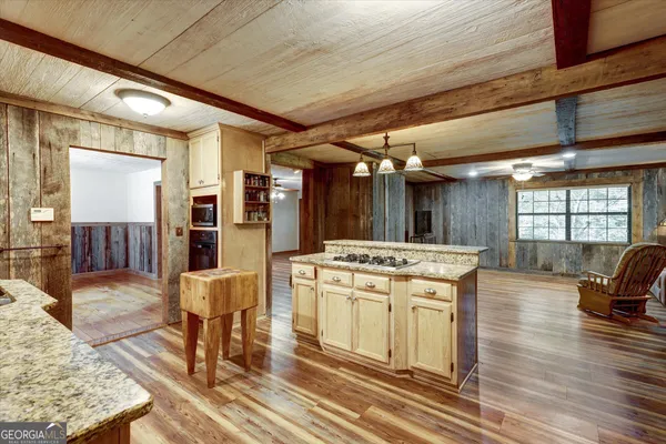 a kitchen with a stove and cabinets