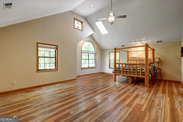 a view of a livingroom with furniture and wooden floor