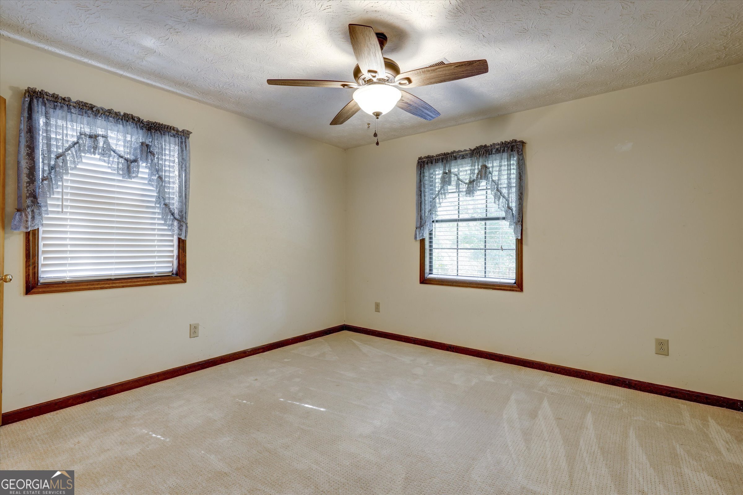 424 Hampton Road Hampton, GA 30228 - Photo 21 of 44 a view of an empty room with a window