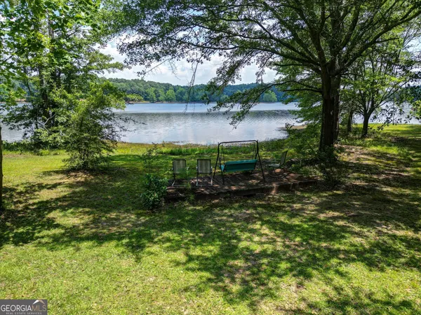 a view of a lake with green space