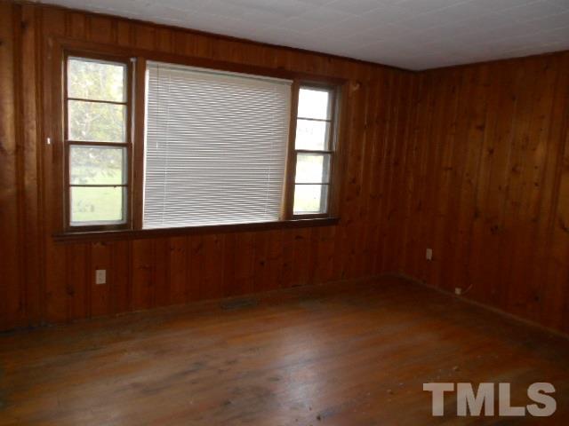 8040 Panther Lake Road Willow Spring, NC 27592 - Photo 3 of 14 an empty room with windows