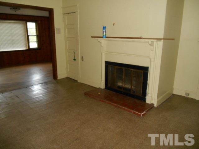 8040 Panther Lake Road Willow Spring, NC 27592 - Photo 5 of 14 a living room with a fireplace
