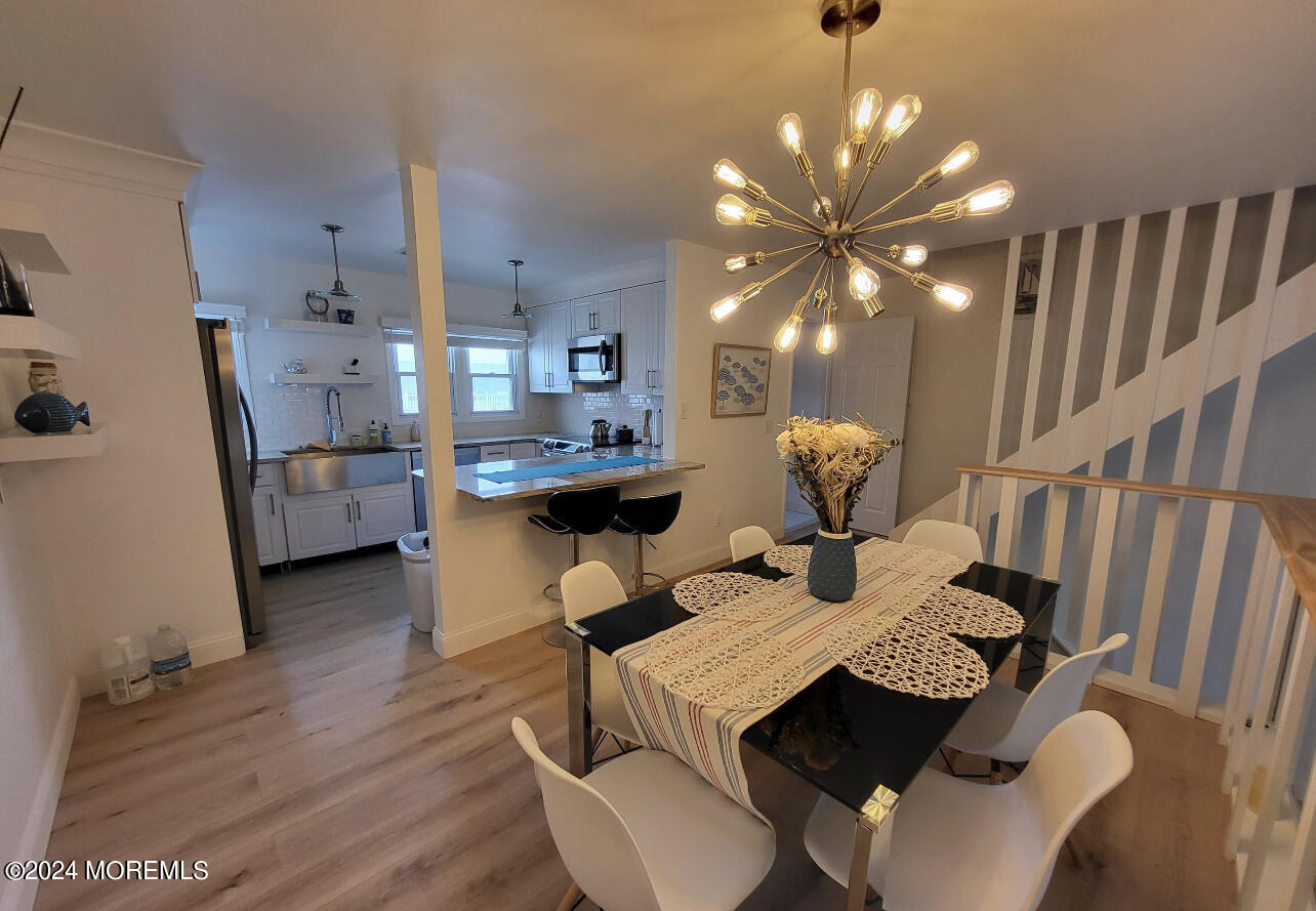 18 Village Road Sea Bright, NJ 07760 - Photo 7 of 29 a living room with furniture and chandelier