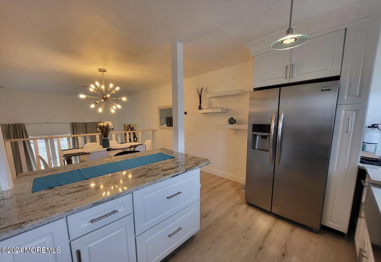 18 Village Road Sea Bright, NJ 07760 - Photo 9 of 29 a kitchen with granite countertop a refrigerator and a sink
