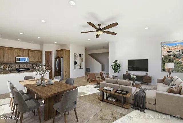 a view of a kitchen with a sink and a refrigerator