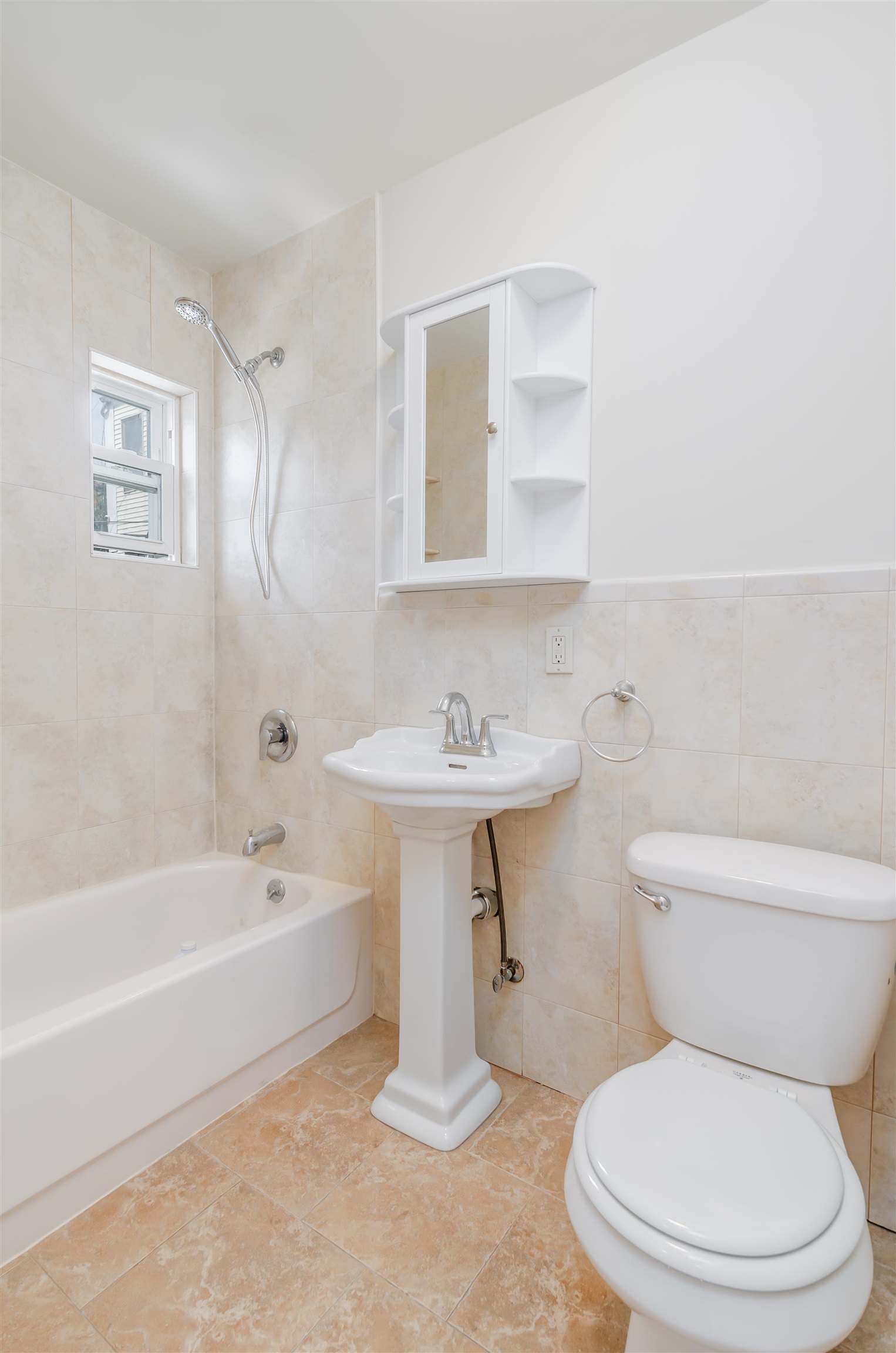 419 22nd Street, Unit 3 Union City, NJ 07087 - Photo 11 of 11 a white toilet sitting next to a bathroom sink