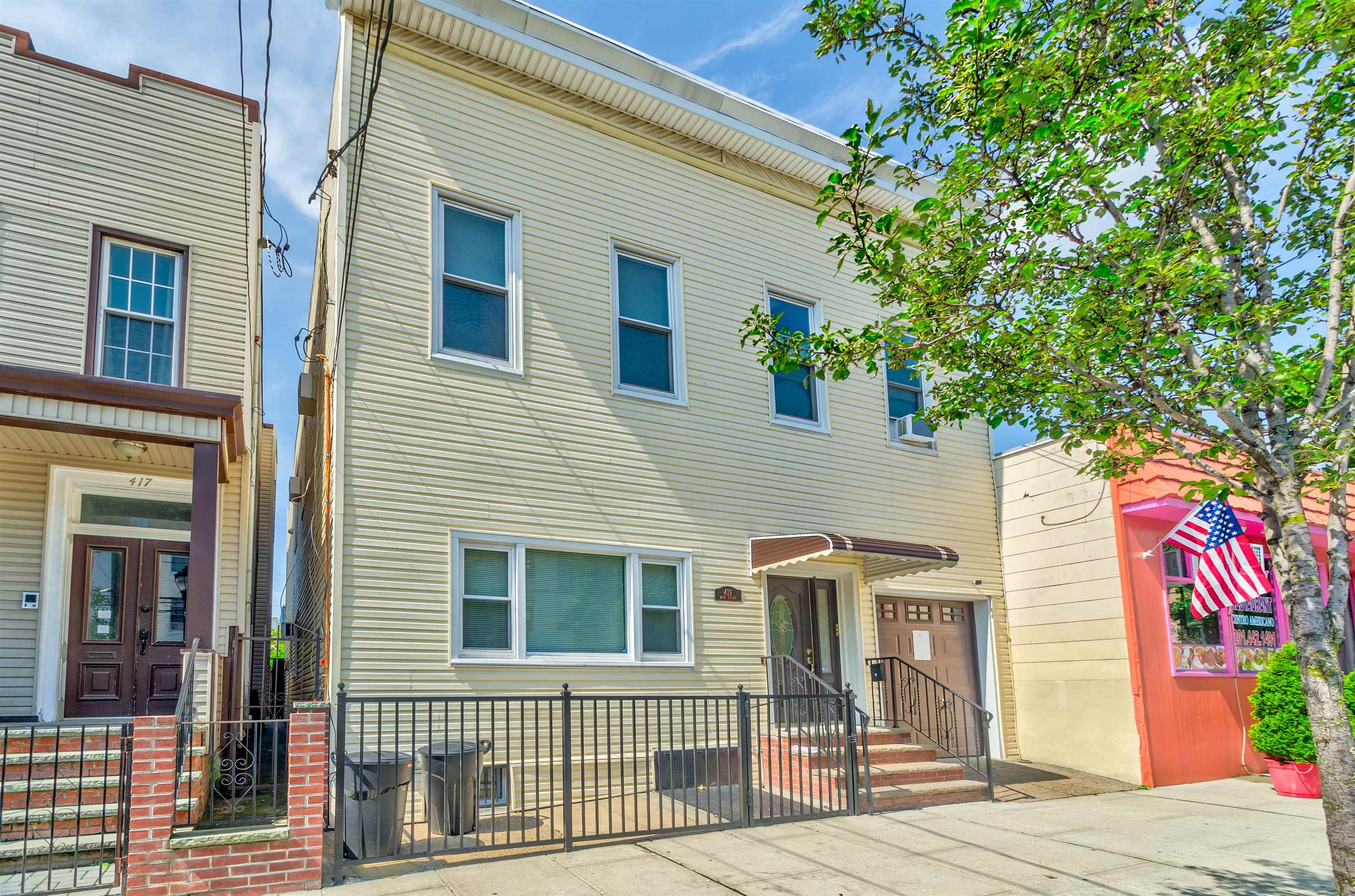 419 22nd Street, Unit 3 Union City, NJ 07087 - Photo 3 of 11 a front view of a house with a garden