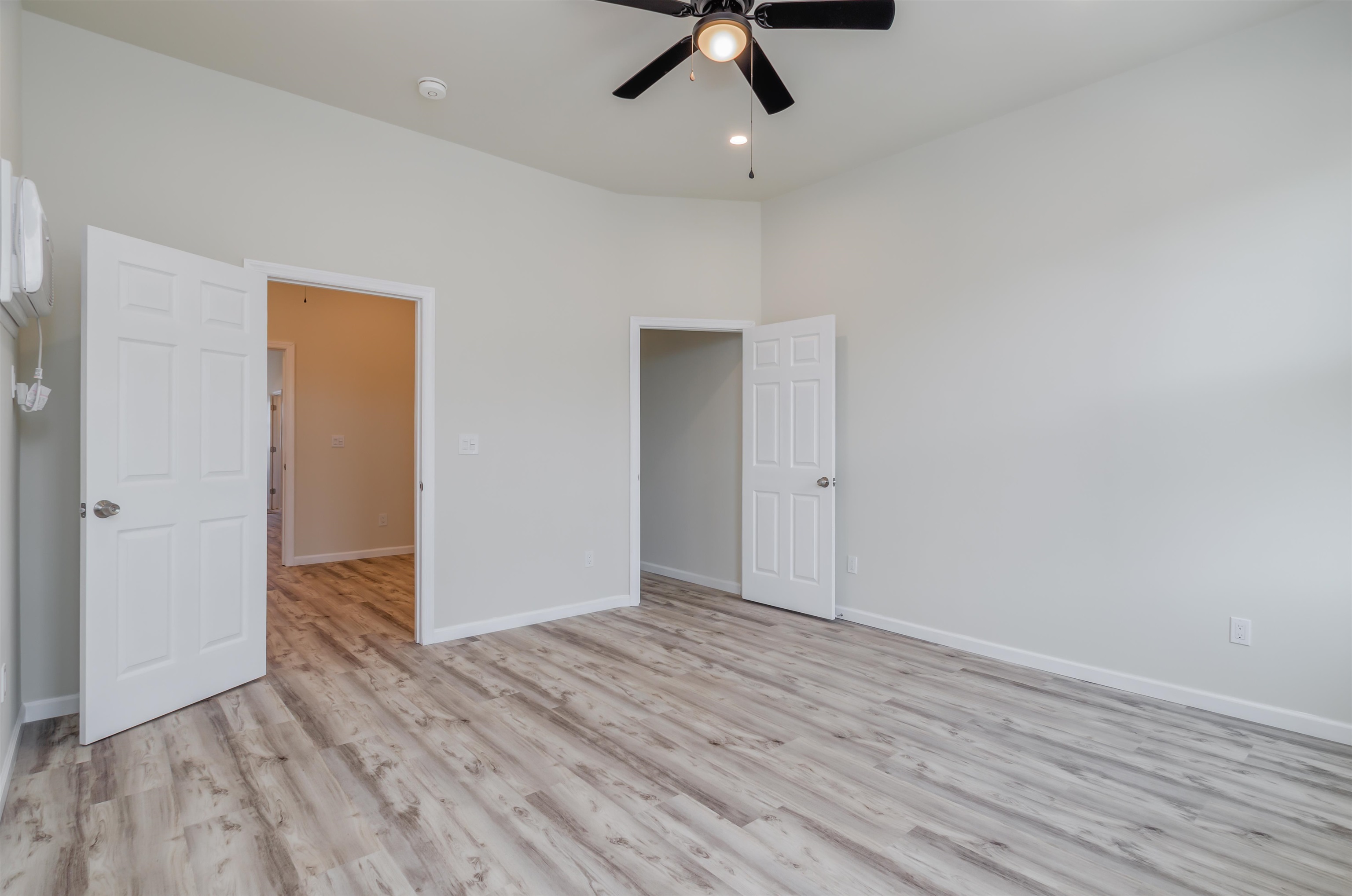 419 22nd Street, Unit 3 Union City, NJ 07087 - Photo 10 of 11 wooden floor in an empty room with a window
