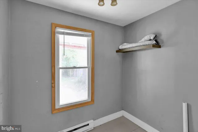 a view of an empty room with a window