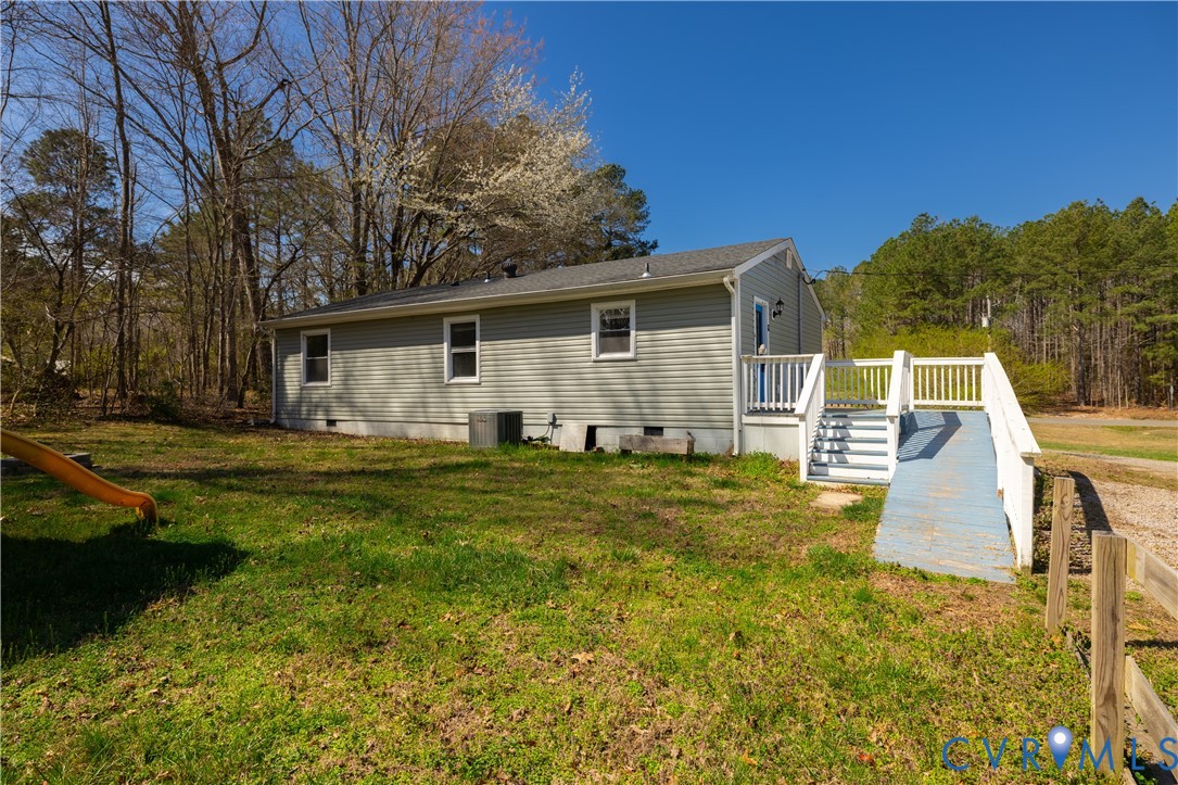 9813 Colemans Lake Road Ford, VA 23850 - Photo 27 of 38 a view of a house with a yard