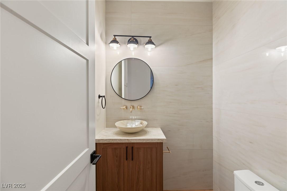 2316 Prometheus Court Henderson, NV 89074 - Photo 25 of 92 Half bath with toilet and vanity